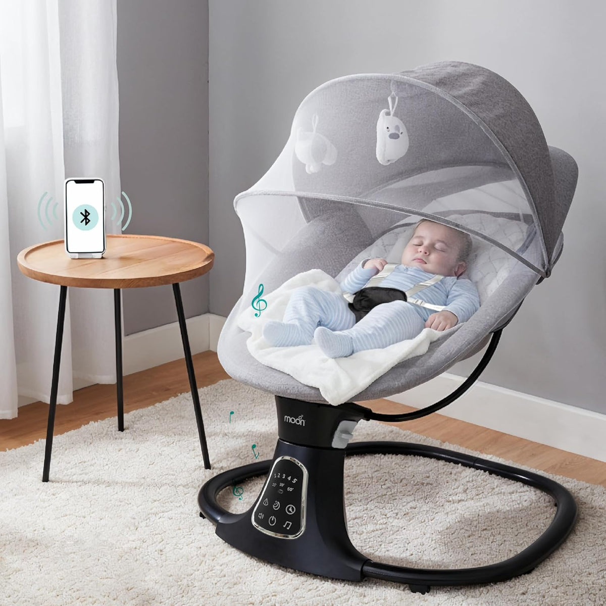 The Moon Brand Koze Baby Swing. 0m+, Holds upto 9kg. Gentle Swaying Motion. In Built Music System. Flexible Speed and Timer Settings. With Remote Control and Mosquito Net. Motion Sensor - The Moon Brand™